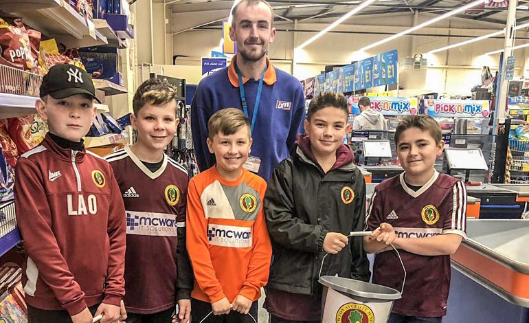 Junior footy team raise £180 from B&M bag-pack