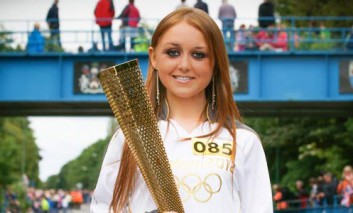 CROWDS FLOCK TO SEE OLYMPIC TORCH
