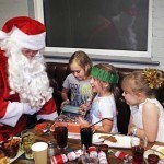 Santa hands out presents at Rof 59 in Newton Aycliffe. Pictured are 7-year-olds Maisie(right) and Summer and 8-year-old Katie(left). Picture by Stuart Boulton. Picture by Stuart Boulton.