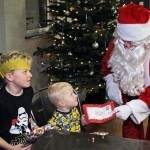 Santa with brothers 4-year-old Alfie and 8-year-old Archie Brown at Rof 59 in Newton Aycliffe. Picture by Stuart Boulton.
