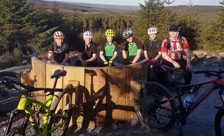 Students get on their bikes during after-school Hamsterley trips