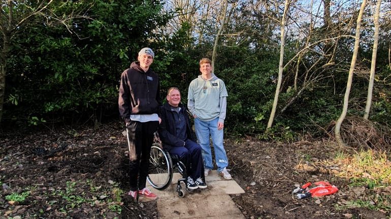 Missionaries ‘shovel’ support to shape woodland garden